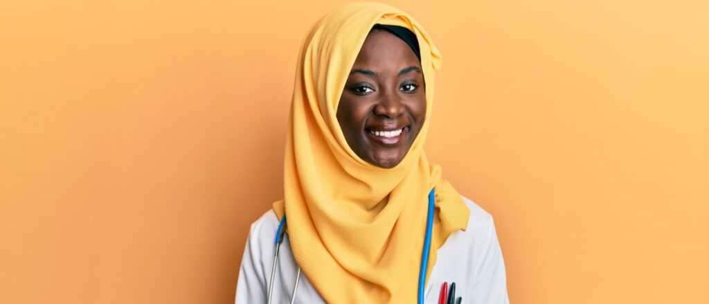 midwife wearing a hijab on an orange background